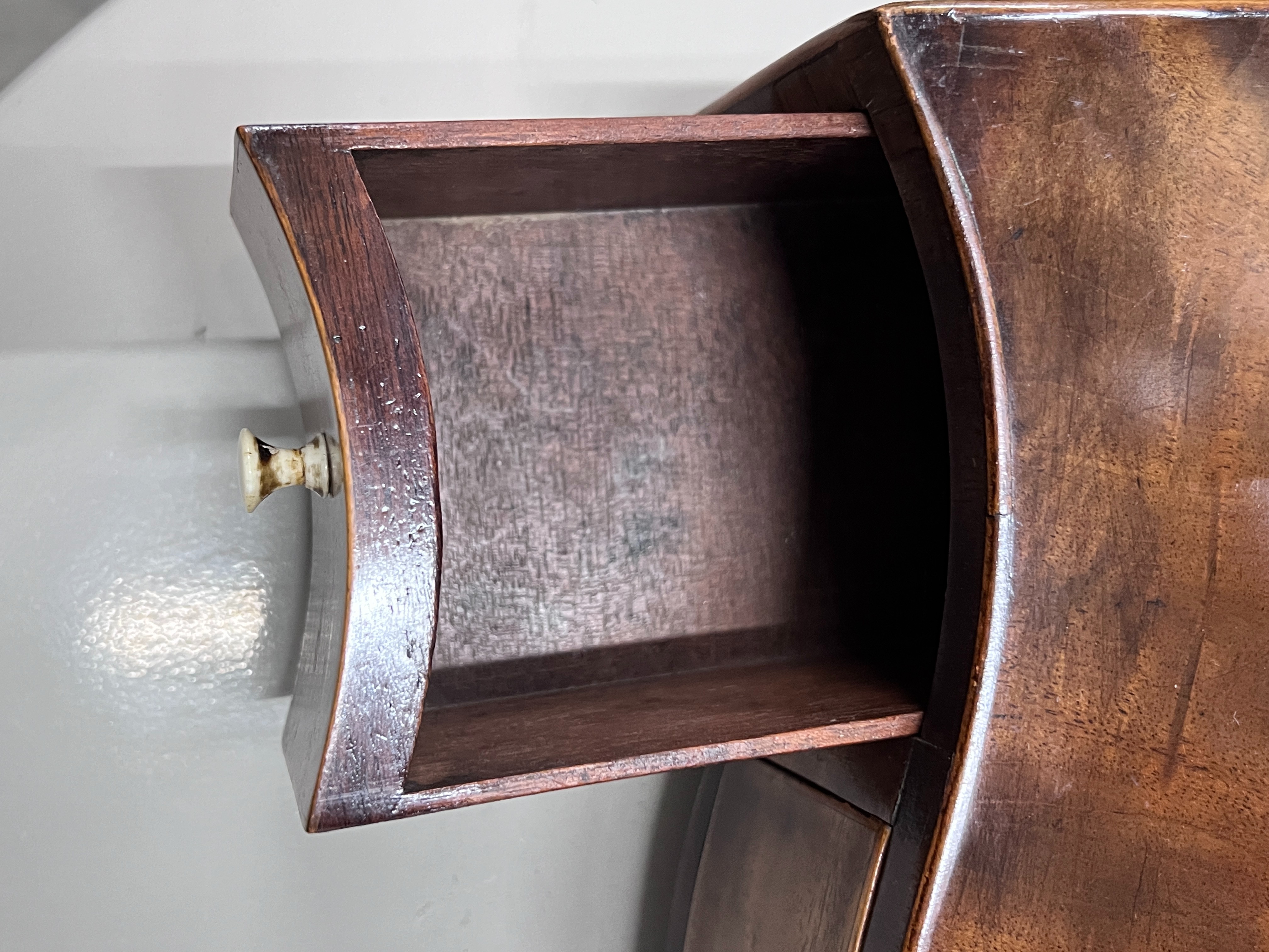 A George III serpentine mahogany box base toilet mirror, width 43cm, depth 21cm, height 57cm